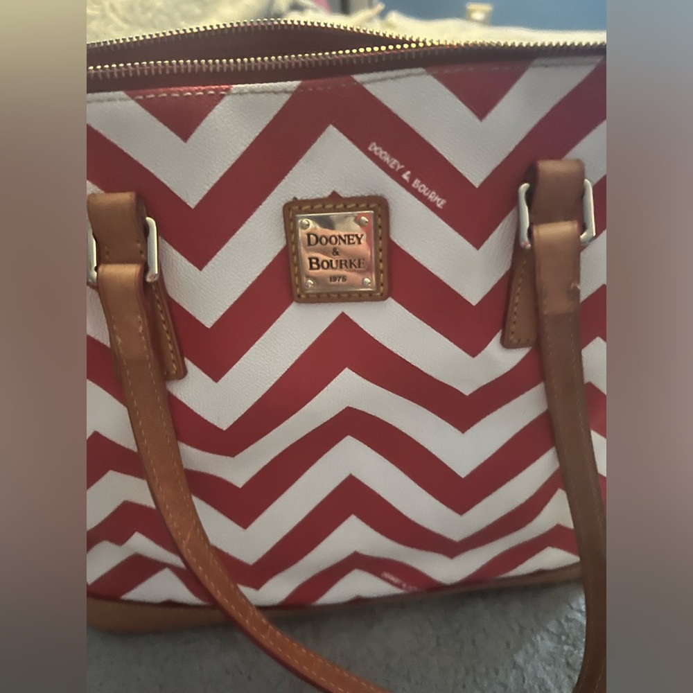 Dooney and Bourke tote bag with matching pouch. Excellent used condition